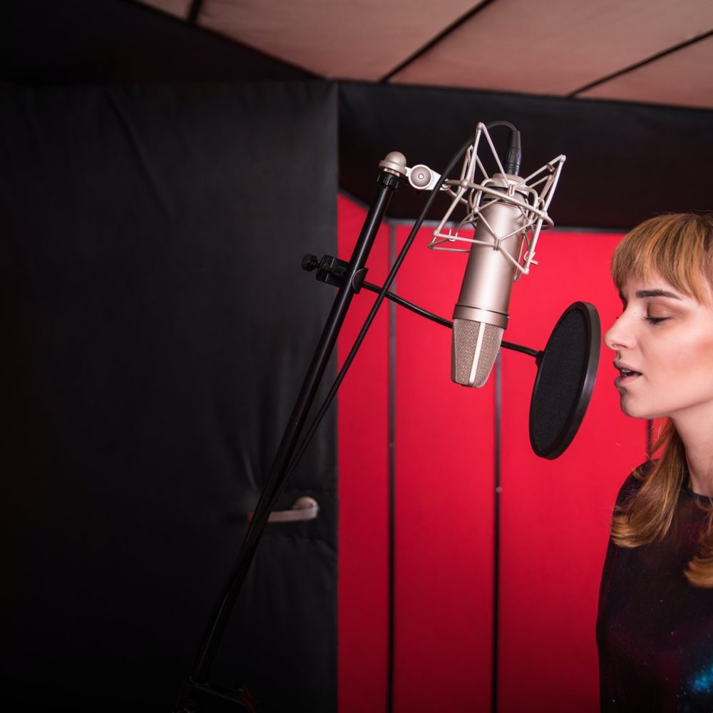 young-singer-woman-during-music-session-at-recording-studio.jpg